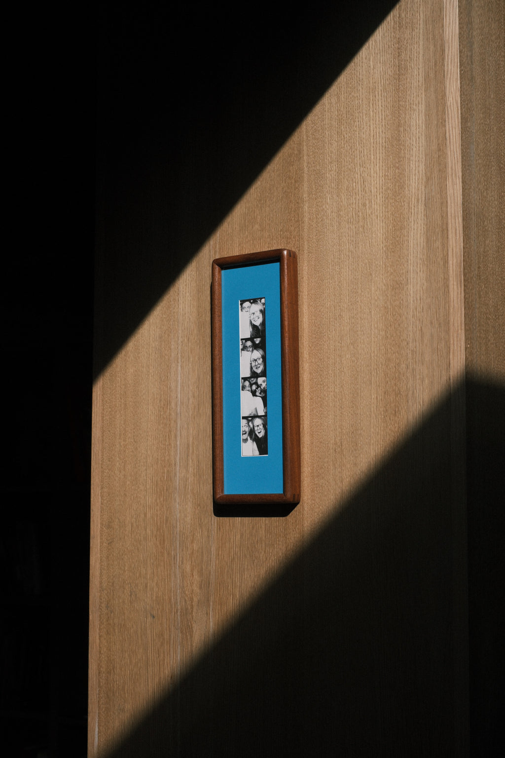 Rounded Walnut Photobooth Frame · Blue Mount
